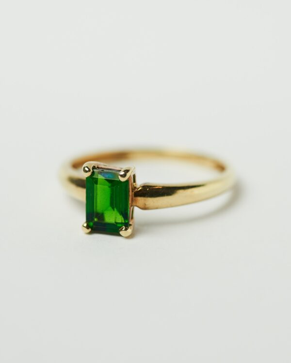 Gold ring with green stone